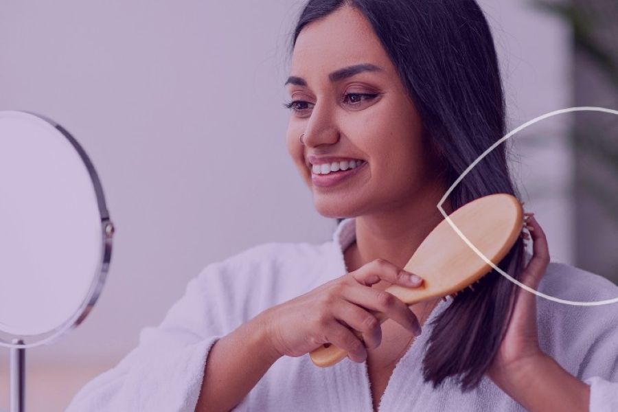 woman brushes hair